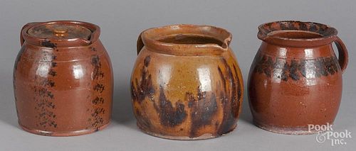 Three redware pitchers, 19th c.