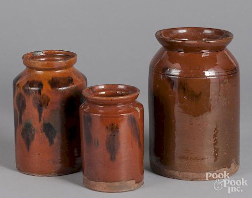 Three redware crocks, 19th c.