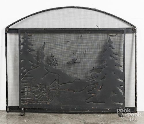Wire firescreen, with cutout landscape with cabin