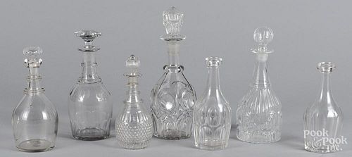 Seven colorless glass decanters, 19th/20th c.