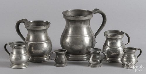 Seven graduated English pewter measures, 19th c.