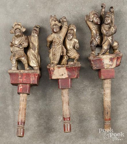 Three Chinese carved and gilded figural groups