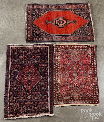 Four Oriental mats.