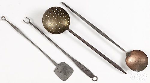 Four dated iron kitchen utensils