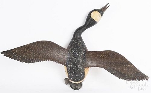 Carved and painted flying Canada goose