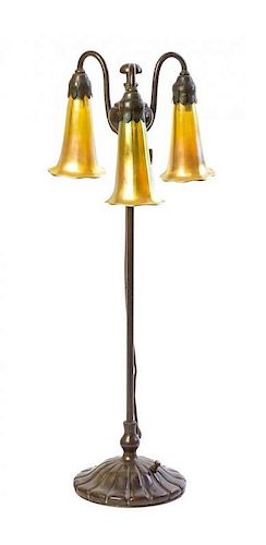 A Tiffany Studios Bronze Three-Light Lily Lamp Base, Height 22 1/8 inches.