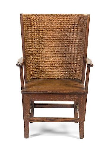 An English Oak and Rush Stronza Open Armchair, Liberty & Co., Height 33 3/4 inches.