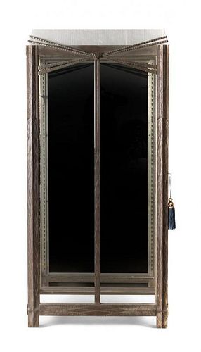 A French Art Deco Iron Vitrine Cabinet, attributed to Paul Kiss, Height 70 x width 33 x depth 14 inches.