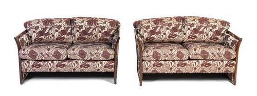 A Pair of French Art Deco Macassar Ebony Settees, Width 54 inches.