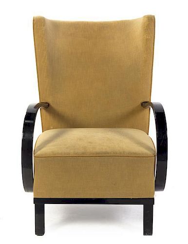 A Danish Art Deco Ebonized Armchair, Height 37 1/8 inches.