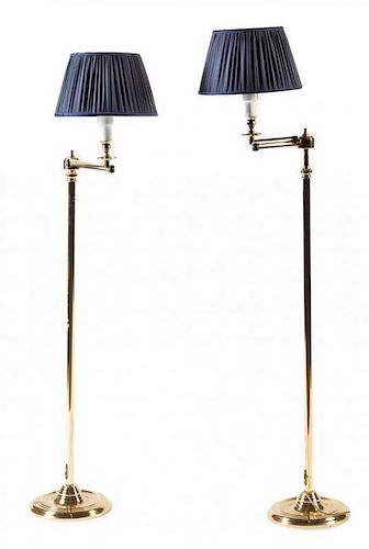 A Pair of Brass Swing-Arm Floor Lamps Height overall 48 1/2 inches.