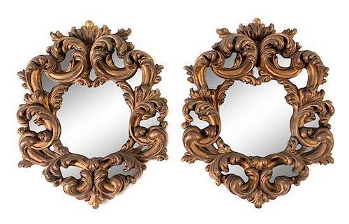 A Pair of Italian Baroque Giltwood Mirrors Height 25 x width 20 inches.