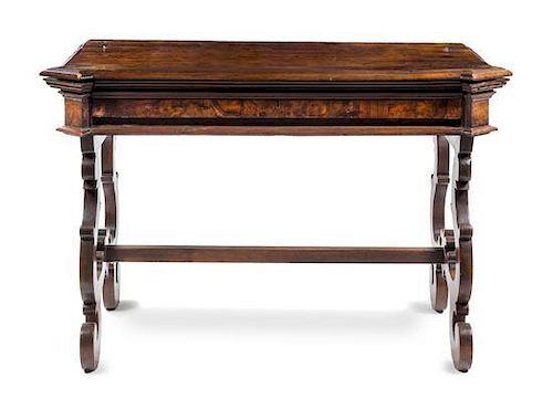 An Italian Baroque Walnut Desk Height 38 x width 56 5/8 x depth 28 1/2 inches.