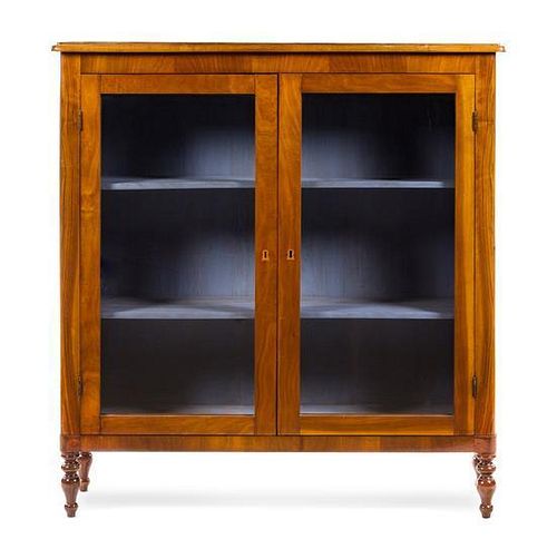 An Italian Walnut Bookcase Height 51 3/8 x width 48 1/2 x depth 13 inches.
