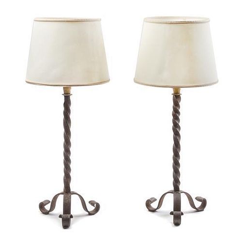 A Pair of Wrought Iron Pricket Sticks Height overall 25 inches.