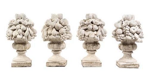 A Set of Four Cast Stone Models of Fruit-Filled Urns Height 25 inches.