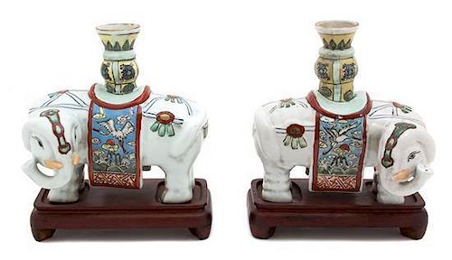 A Pair of Chinese Famille Rose Porcelain Caparisoned Elephants Height 9 1/2 inches.