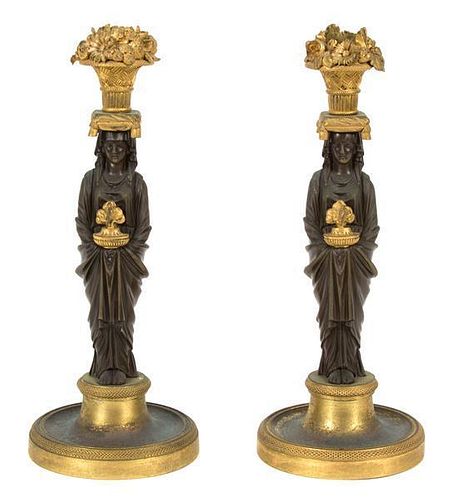 A Pair of French Empire Bronze and Gilt Bronze Figural Candlesticks Height 10 1/2 inches.