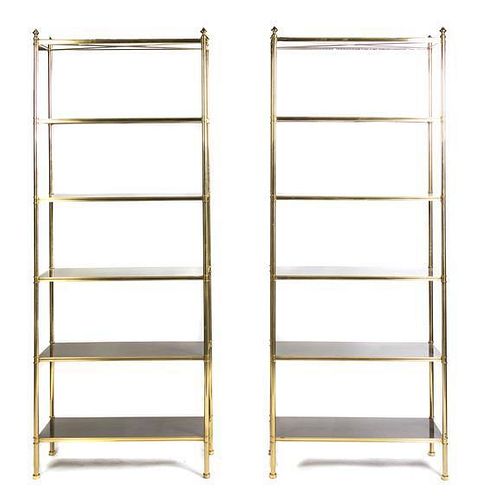 A Pair of American Brass Porter Etageres, after the design by Billy Baldwin, Height 92 x width 36 x depth 13 1/4 inches.