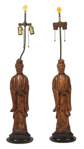 A Pair of Chinese Carved Wood Figural Lamps Height 39 1/2 inches.