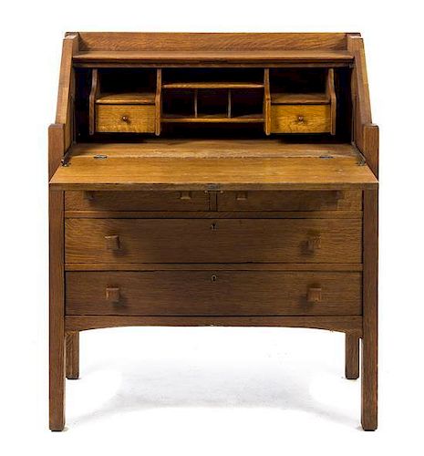 An Arts and Crafts Style Oak Bureau, Height 42 1/2 x width 35 3/4 x depth 15 1/2 inches.