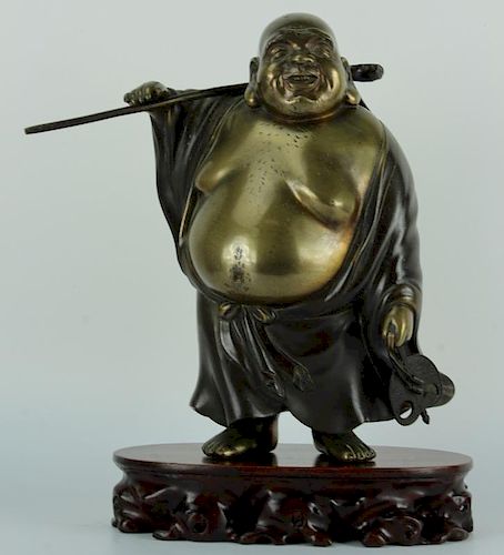 Japanese bronze figure of Hotei the god is shown