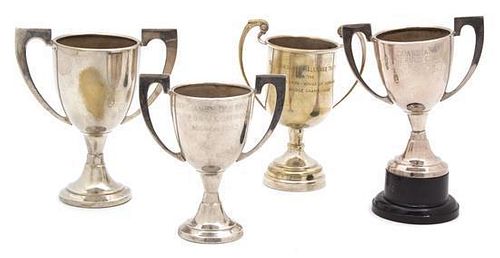 A Group of Four Diminutive Silver Plate Trophy Cups Height of tallest 5 3/4 inches.