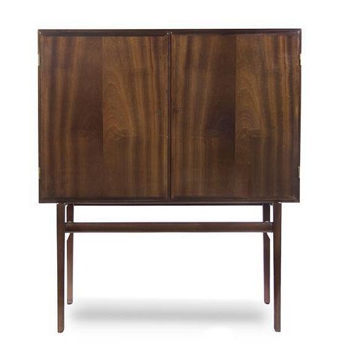 A Danish Mahogany Cabinet, Ole Wanscher (1903-1985), Height 55 1/4 x width 47 1/4 x depth 15 7/8 inches.