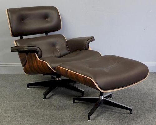 Eames Style Leather Upholstered Chair and Ottoman.