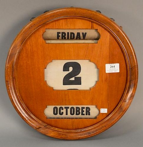 Mahogany day and date calendar, manually operated. dia. 14 1/2in.