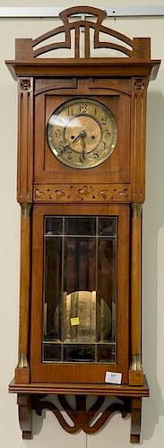 Walnut regulator clock with brass dial and two brass weights. ht. 38in., wd. 12in.