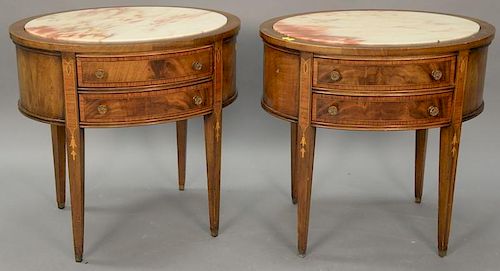 Pair of mahogany oval tables with inset marble tops. ht. 27in., top: 20" x 28"