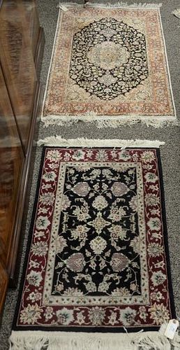 Two Oriental throw rugs (one silk). 2'6" x 4' and 2' x 3'.
