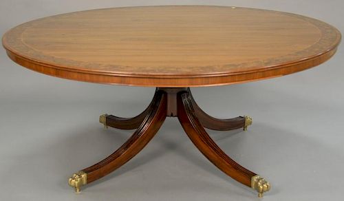 Round mahogany dining table with single pedestal base with banded burl wood inlay along with extra felt covered custom top to