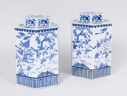 NEAR PAIR OF CHINESE HEXAGONAL BLUE AND WHITE PORCELAIN JARS AND COVERS