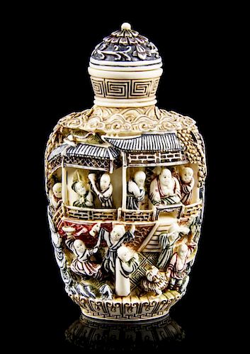 A Polychrome Decorated Ivory Snuff Bottle, Height overall 3 1/2 inches.