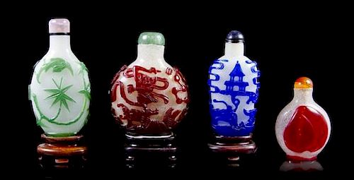 Four Peking Glass Overlay Snuff Bottles, Height of tallest 2 7/8 inches.