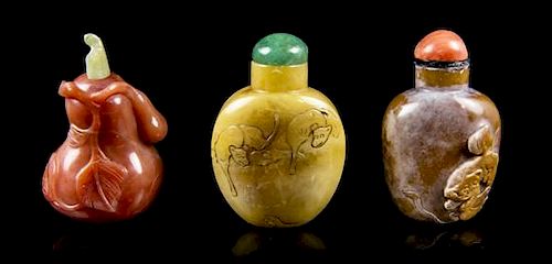 A Group of Three Hardstone Snuff Bottles, Height of tallest 2 1/4 inches.