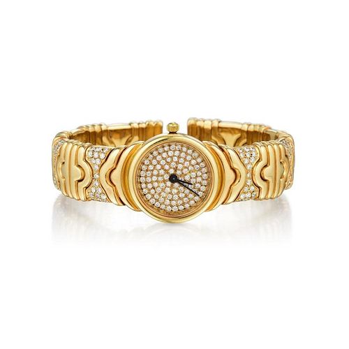 An 18K Gold Diamond Bangle Watch