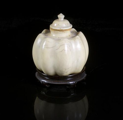 A Carved Ivory Snuff Bottle, Height overall 2 1/2 inches.