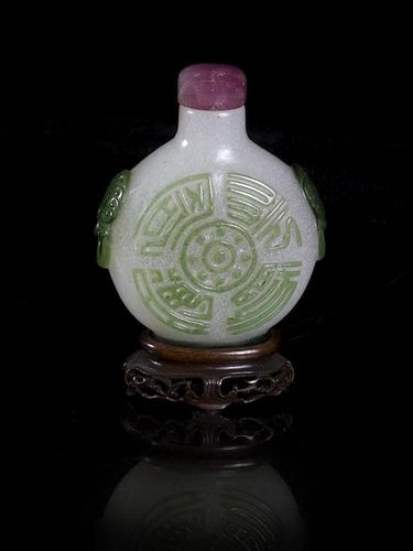 A Peking Glass Snuff Bottle, Height 2 1/4 inches.