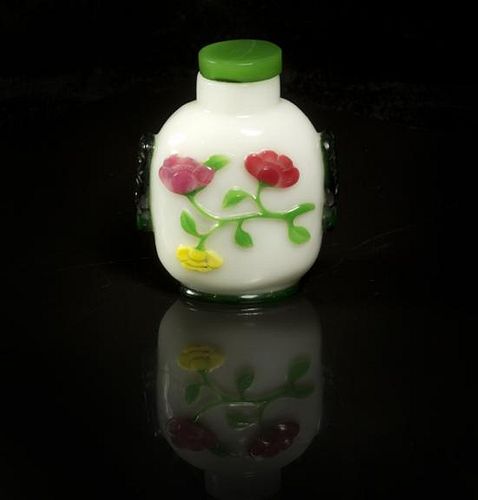 A Peking Glass Snuff Bottle, Height of bottle 2 1/2 inches.