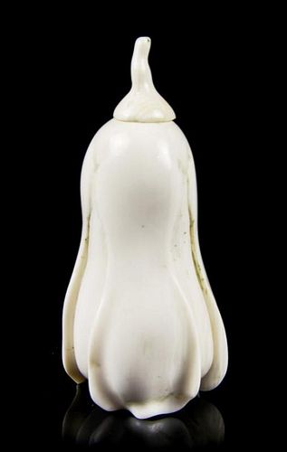 A Carved Ivory Snuff Bottle, Height overall 2 7/8 inches.