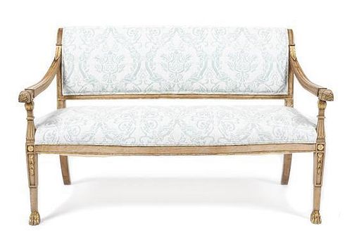 An Italian Walnut and Parcel Gilt Settee, Height 34 1/4 x width 54 1/4 x depth 19 3/4 inches.