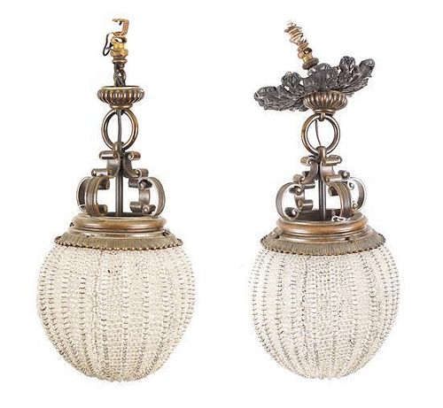 A Pair of Art Deco Bronze and Clear-Beaded Hall Chandeliers, Height 22 inches.