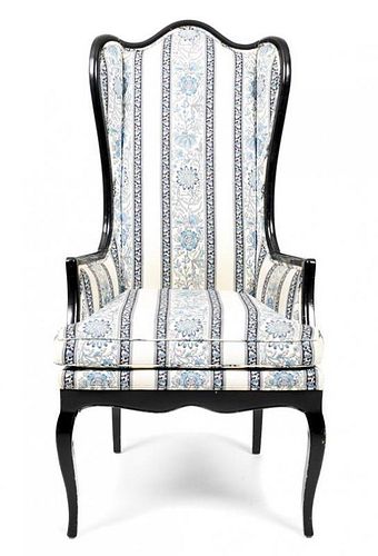 A George III Style Black Lacquered Wingback Armchair, Height 51 3/8 x width 24 3/8 inches.