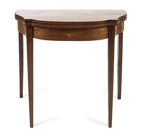 A George III Style Walnut Fruitwood Strung Flip-Top Tea Table, Height 30 5/8 x width 35 1/4 x depth (closed) 17 3/4 inches.