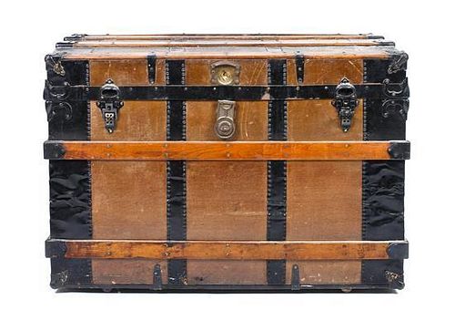 A Vintage Canvas, Oak and Metal Banded Steamer Trunk, Height 22 x width 38 1/4 x depth 23 1/4 inches.