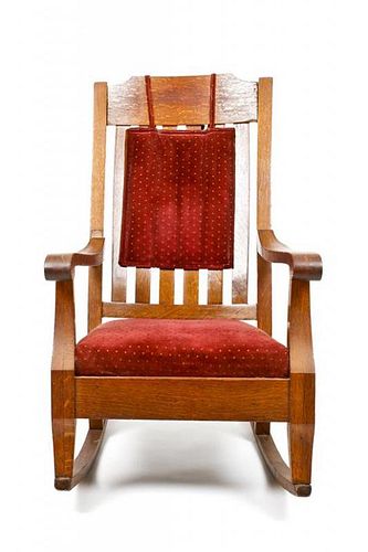 An Arts and Crafts Oak Rocker, Height 41 inches.