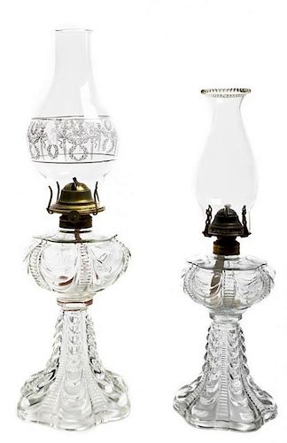 Two Pressed Colorless Glass Oil Lamps, Height of taller 9 1/2 inches.
